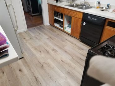 Luxury vinyl plank flooring in kitchen.