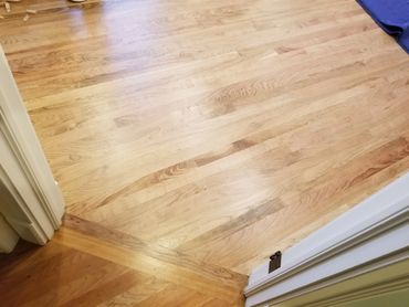 American Cherry installed and finished in a Kenilworth bedroom with a flush transition to an existin