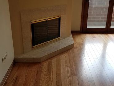 Custom fireplace border in prefinished wood by Somerset Oak in Park Ridge.