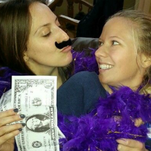 Dance party girls holding money posing with mustache