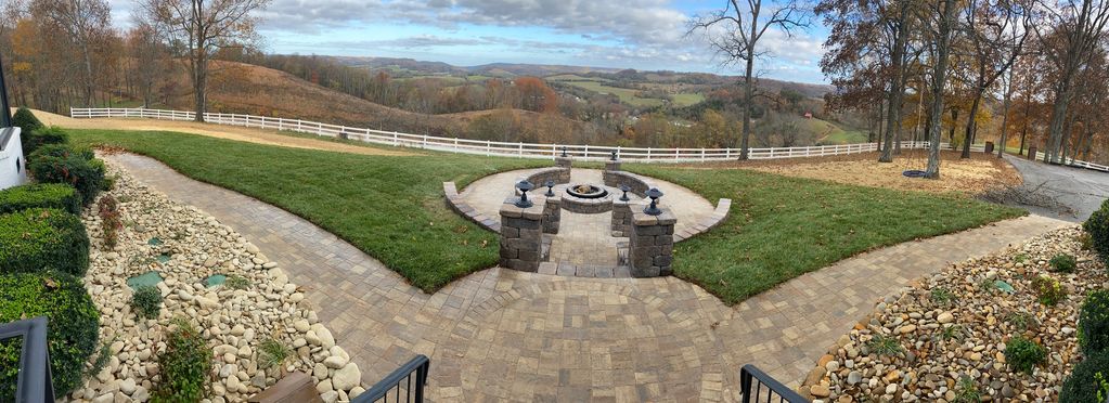 Paver walkway with fire pit and seating walls with columns