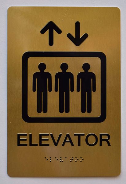 Elevator SIGN- GOLD- BRAILLE (ALUMINUM SIGNS 9X6)- The Sensation Line- Tactile Touch Braille Sign