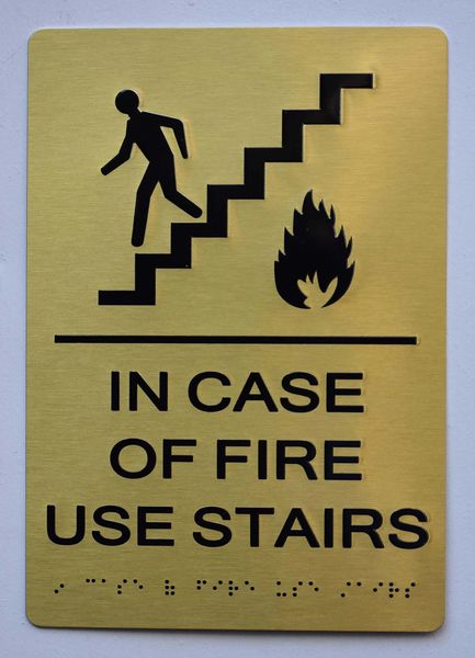 In Case of Fire Use Stairs SIGN- GOLD- BRAILLE (ALUMINUM SIGNS 9X6)- The Sensation Line