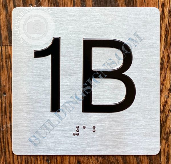 z- APARTMENT NUMBER SIGN – 1B -BRUSHED ALUMINUM (ALUMINUM SIGNS 4X4)- THE SENSATION LINE- Tactile Touch Braille Sign