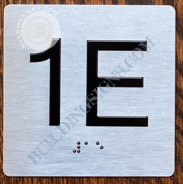 z- APARTMENT NUMBER SIGN – 1E -BRUSHED ALUMINUM (ALUMINUM SIGNS 4X4)- THE SENSATION LINE- Tactile Touch Braille Sign