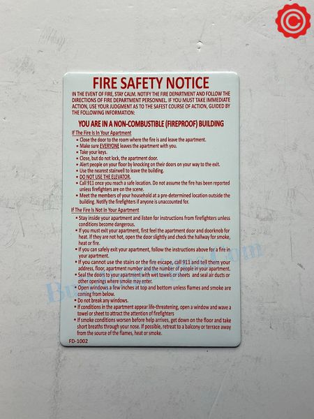 FIRE SAFETY NOTICE FOR NONCOMBUSTIBLE/ FIREPROOF BUILDINGS- WHITE BACKGROUND AND RED LETTERS (ALUMINUM SIGNS 8.5x11)