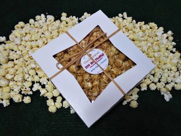 Caramel popcorn in large gift box perfect for holiday, business or corporate party gifts.