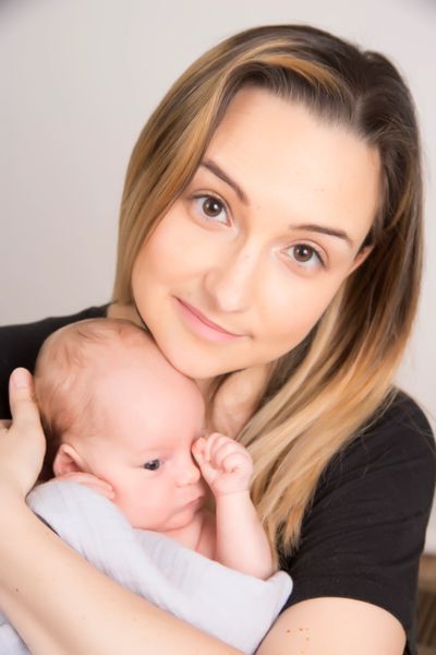 Amandine, Mama Moon's owner and doula, cuddling with baby. Nashville, Doula, childbirth education