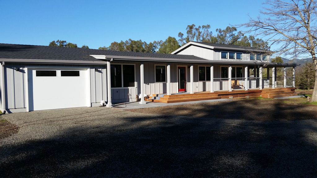 Added garage, clear story living room, screened porch and wrap around deck.
