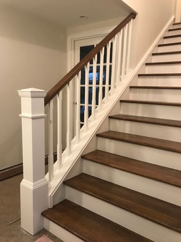 Basement remodel after new stairs. Newel post, Balustrades, Red Oak hand rail, Red Oak treads 