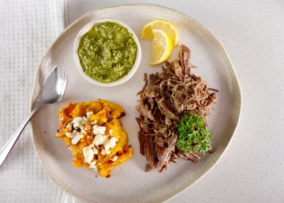 Keto Loco's pre-packaged beef brisket with pumpkin and feta smash, drizzled in chimichurri