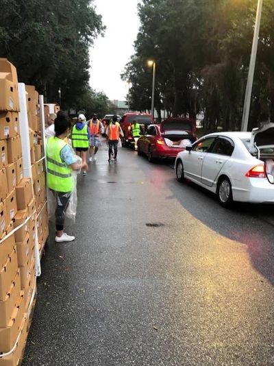 St John's volunteers distributing boxed goods