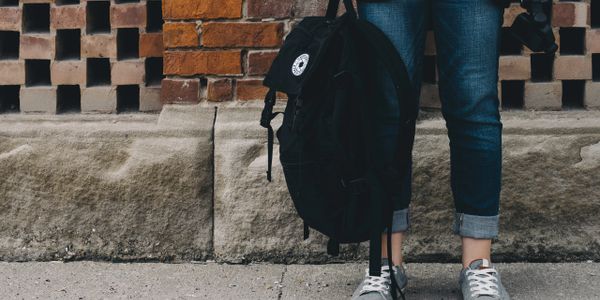 student with backpack