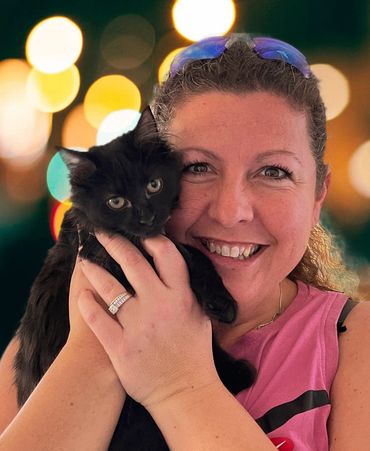 Portrait of volunteer holding a cat