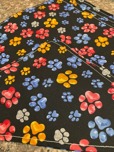 Multi color paw prints on black