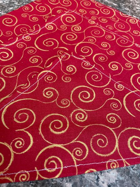 Gold swirls on red