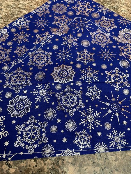 Silver snowflake on blue