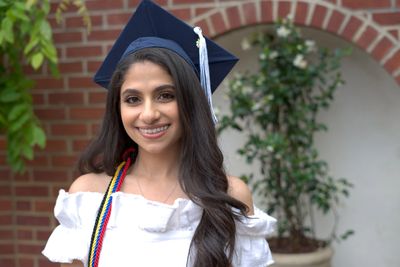 A photo of a woman with a graduation cap on in Delaware. Delaware Graduation Photos. Graduation.