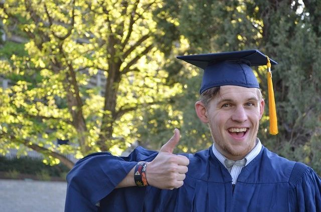 a graduate student with cap and gown