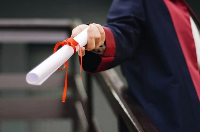 Woman holding a diploma