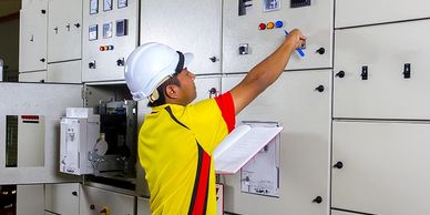 worker inspecting machine