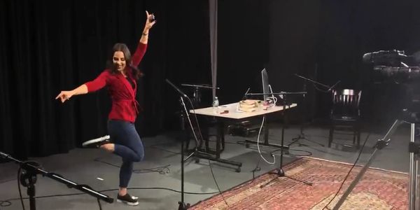 Person dancing around equipment in studio