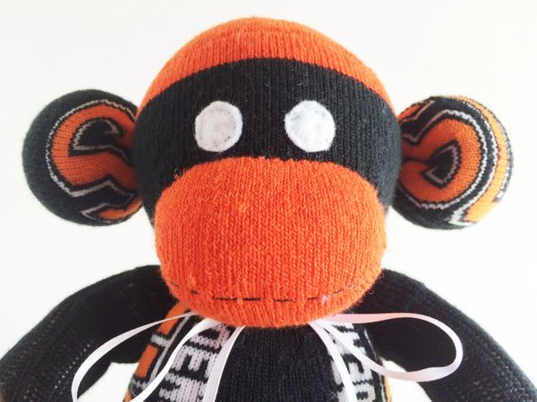 Orange 2024 sock monkey