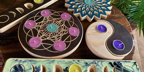 Intricately carved wooden tea light holders with beautiful aromatherapy tea lights inside.