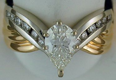 Lady's 1-1/2ctw Pear and Round Diamond Engagement Ring