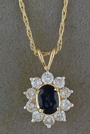 Oval cut Sapphire and Round Diamond Pendant on a 19" Chain