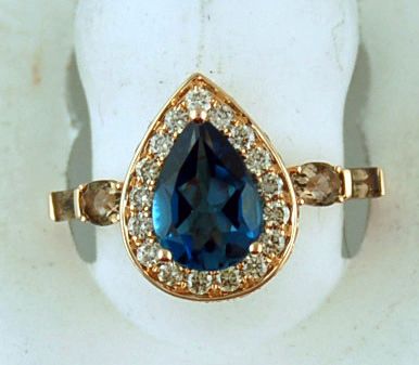 Blue Pear Stone With Oval And Bauette Brown Stones With 40 Diamonds