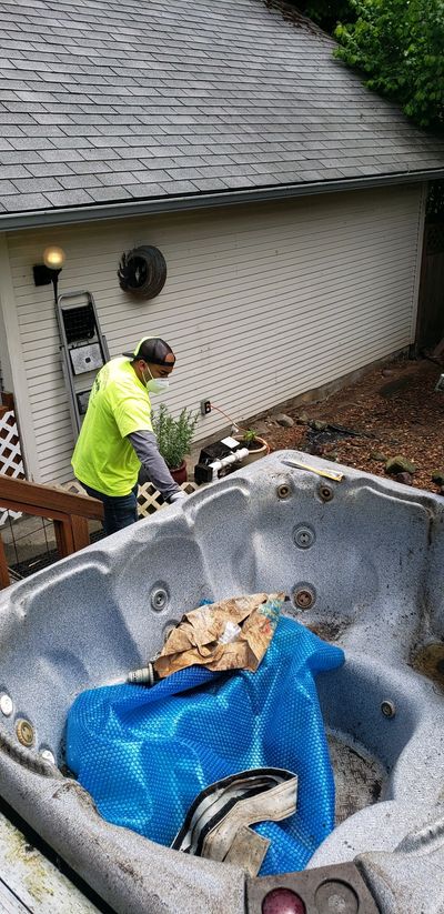 Our team removing an old hot tub from its existing location