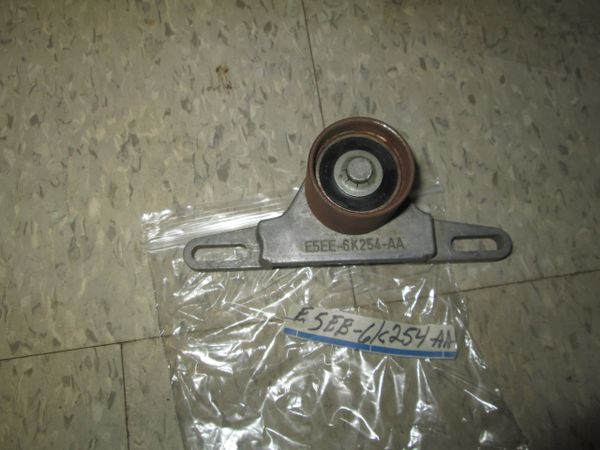 E5EE6K254-AA GENUINE OEM ENGINE TIMING BELT ROLLER TENSIONER NOS