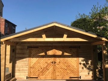 rustic wooden cladded garage