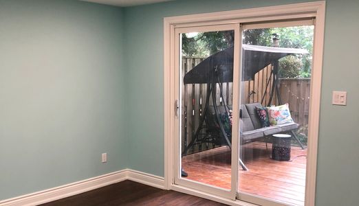 Budget friendly walkout basement renovation completed by Leslie Renovations in Ontario.