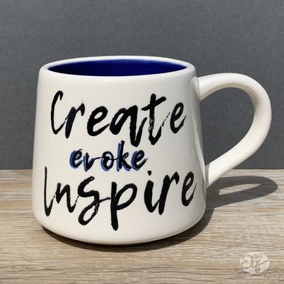 Create evoke inspire hand painted on a mug