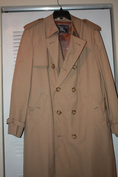 BURBERRYS RAINCOAT. 47 inches long and 21 inches across shoulders. FOR MAN OR WOMAN
