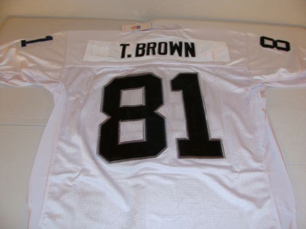 Tim Brown player worn jersey patch football card (Oakland Raiders