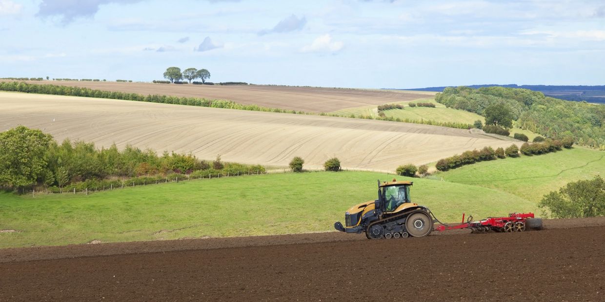 Cat Challenger cultivating an arable field