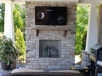 TV wall mount over fireplace.