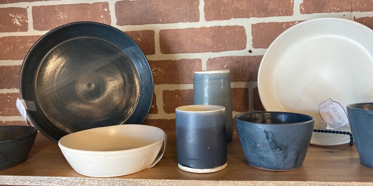 Assortment of kitchen pottery on shelf
