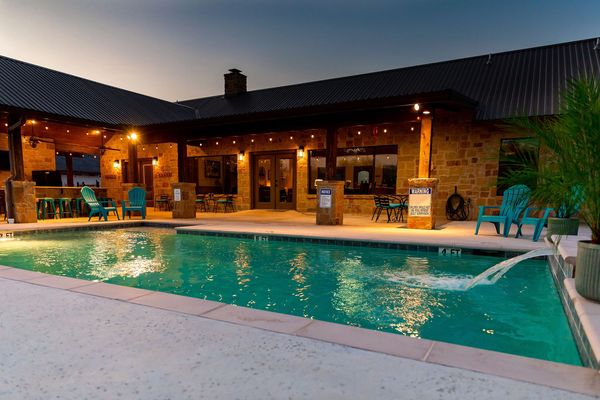 This is an image of the pool at Branding Iron Lodge in Concan TX.