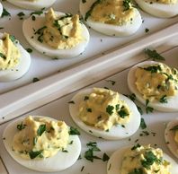 Herbed Deviled Eggs topped with fresh parsley.