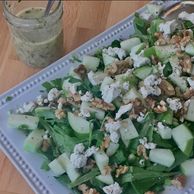 Apple, gorgonzola, walnut arugula salad served with champagne vinaigrette on the side.