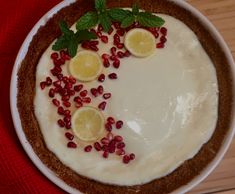 Lemon Sour Cream pie with a graham cracker crust and topped with fresh myer lemon slices.