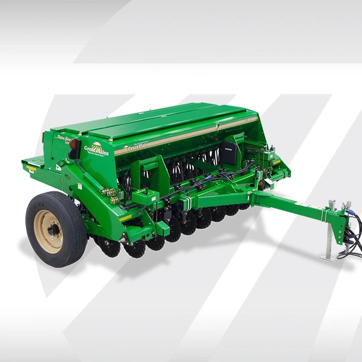 Green agricultural seeder machine with wheels and multiple planting units.