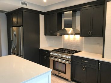 Full kitchen renovation with black and white finishes
