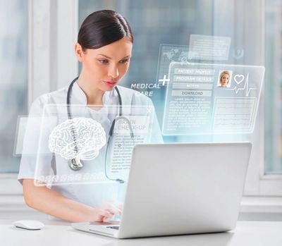 Healthcare professional with stethoscope on neck looking at laptop with overlay of patient profile