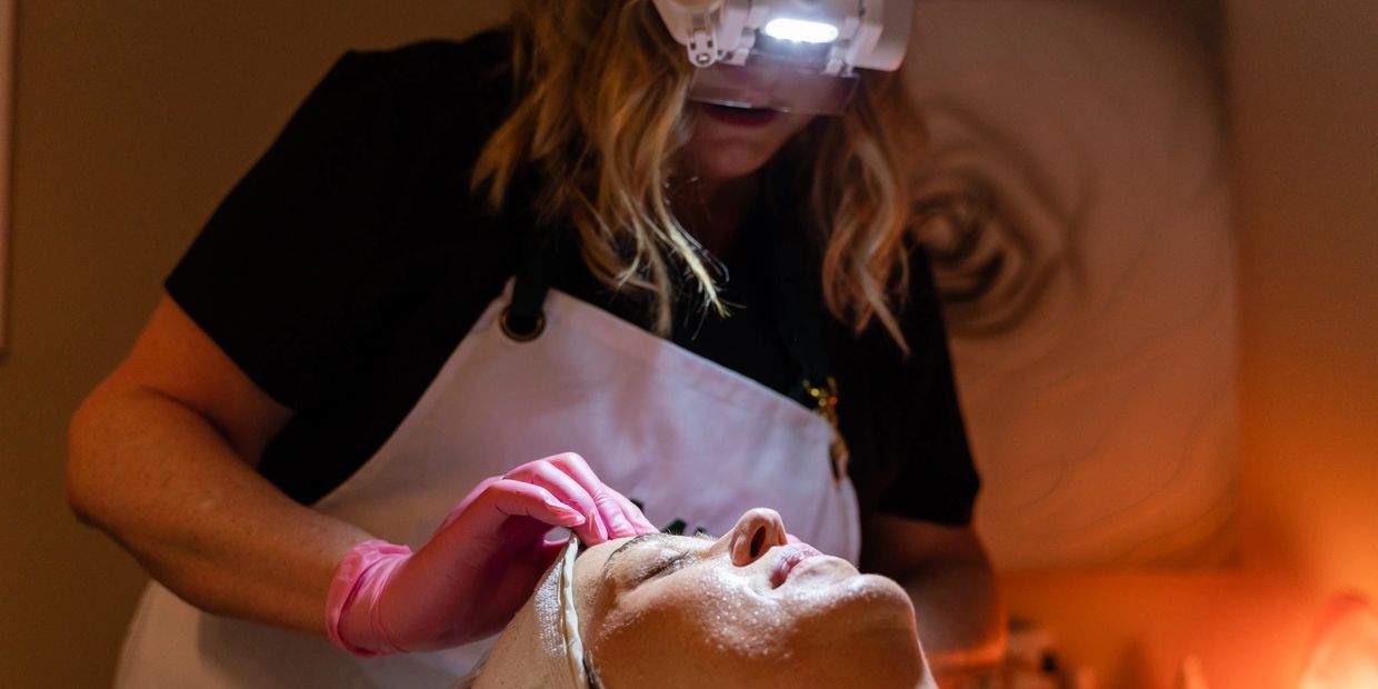 A skin care professional with her tools