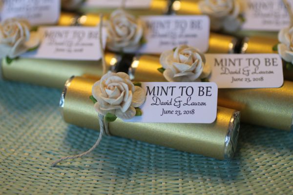 gold wedding favors, mints personalized with gold wrapping and white roses